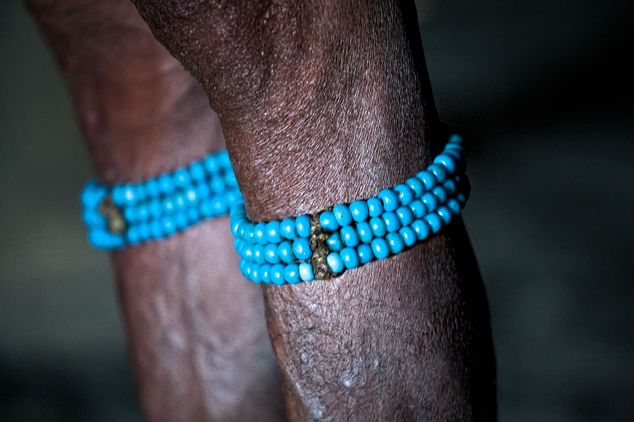  The string of blue beats are sign of the chiefs (Angh) position.  Longwa   on the border with Myanmar